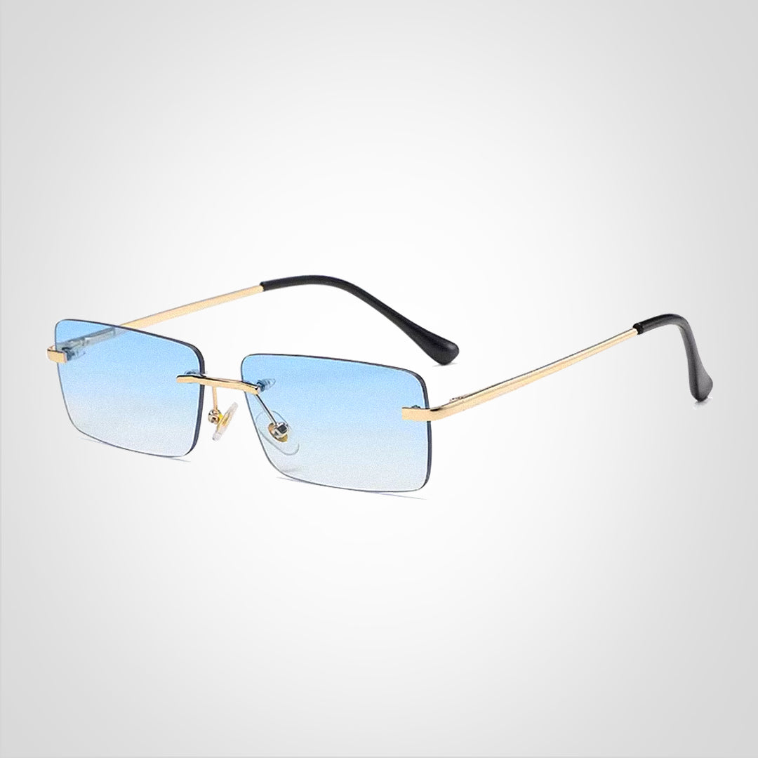 ShadeGuard | Solbrille – Elegance til Hverdag og Eventyr Guldramme blå linse Nuvenci.dk